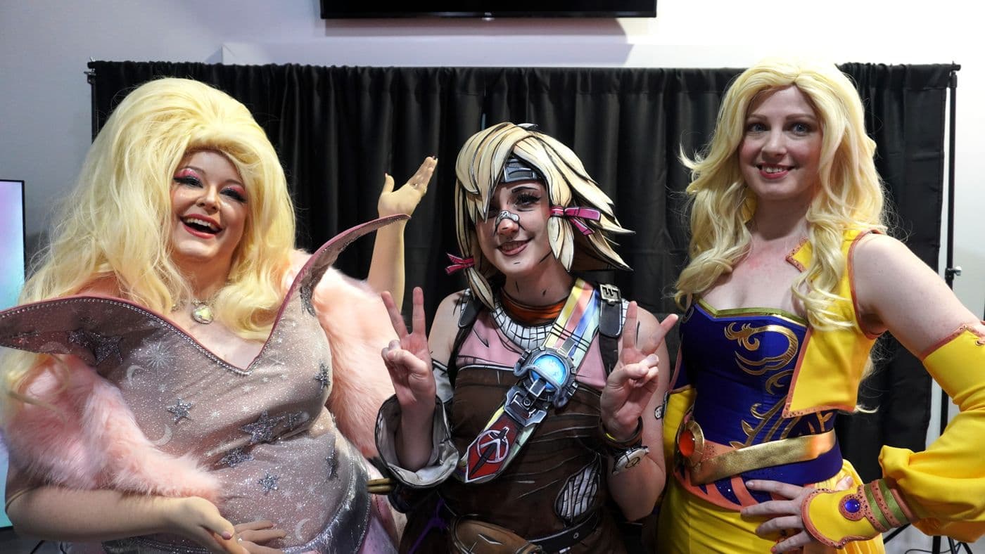 Three cosplayers on the show floor